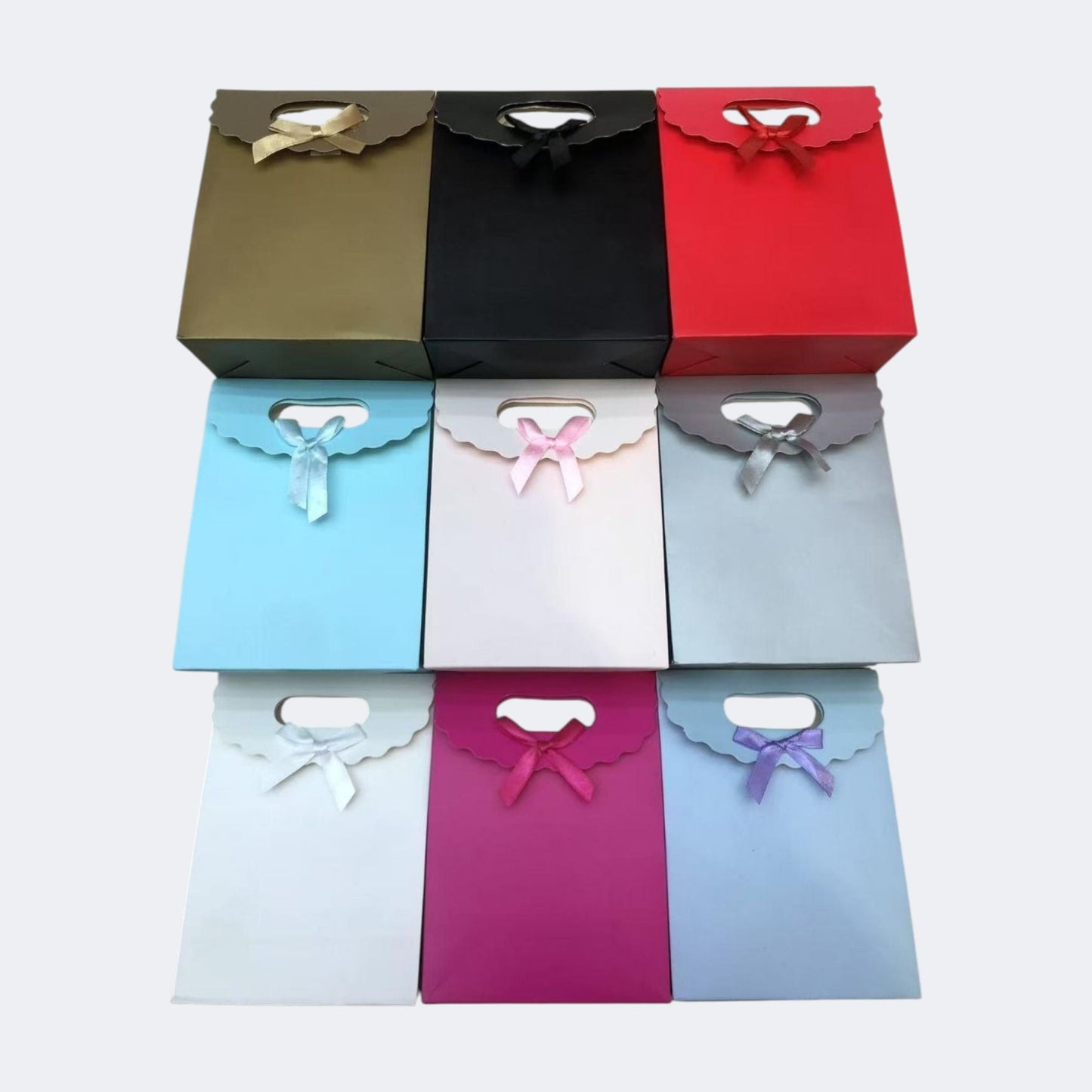 BOLSA REGALO M LAZO 19*9*27CM